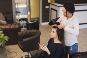 brunette girl getting her hair done